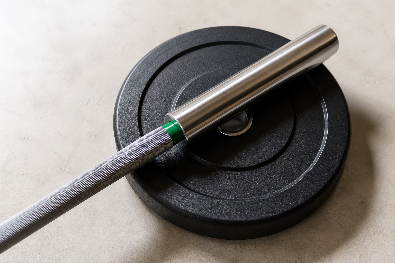 Steel barbell and a plate on gypsum.